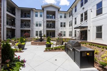 The Legacy at Walton Kennesaw Mountain beautiful courtyard with gas grills fountain